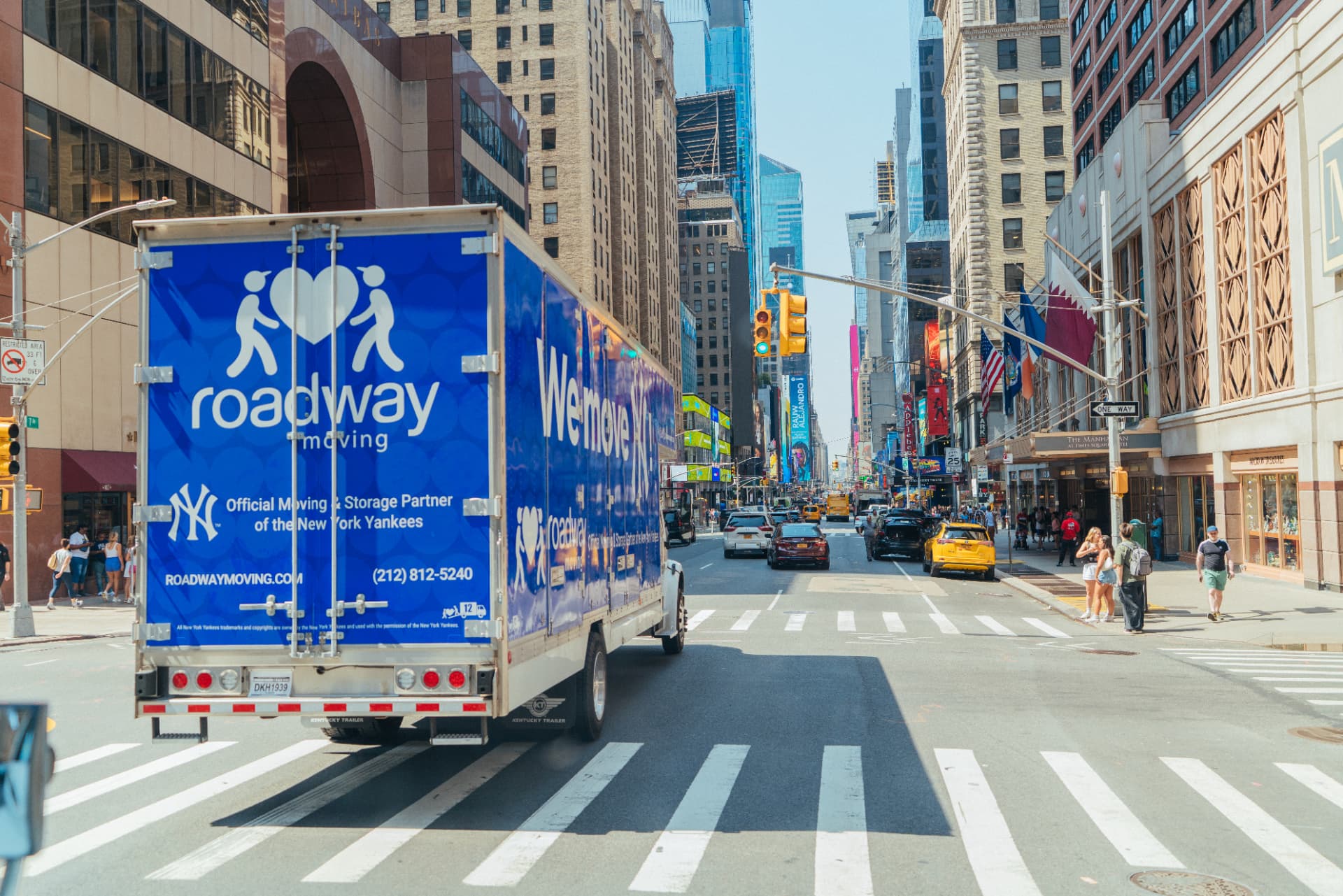 Roadway Moving truck driving down a Manhattan avenue